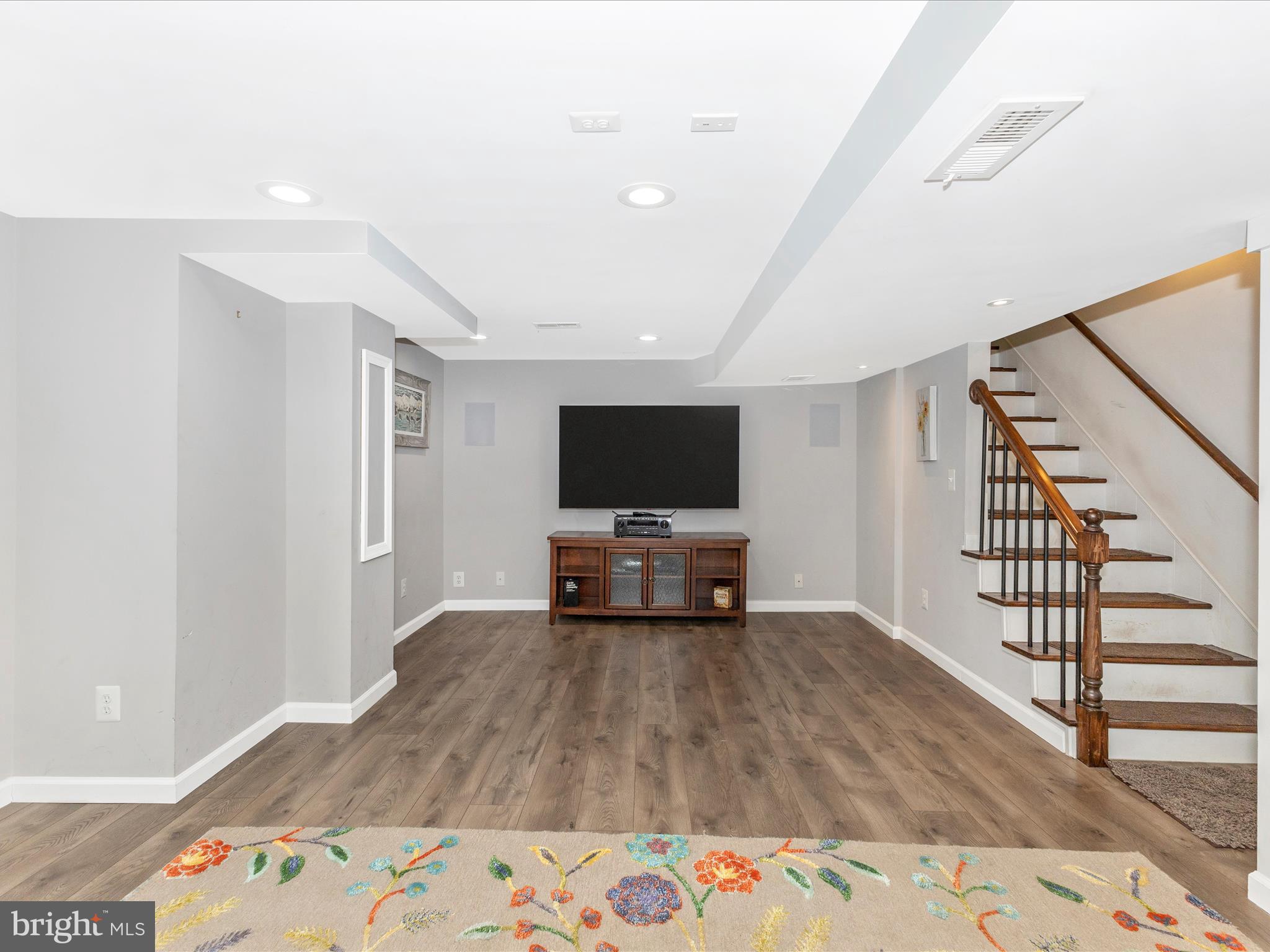 507 Kerwin Court Silver Spring, MD 20901 - Photo 29 of 51 a living room with a bed furniture and a flat screen tv