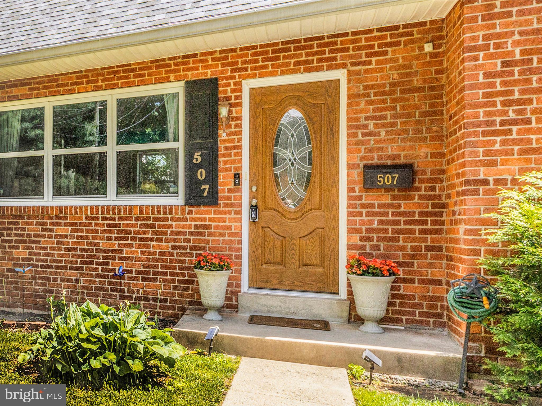 507 Kerwin Court Silver Spring, MD 20901 - Photo 3 of 51 a front view of a building with a potted plant