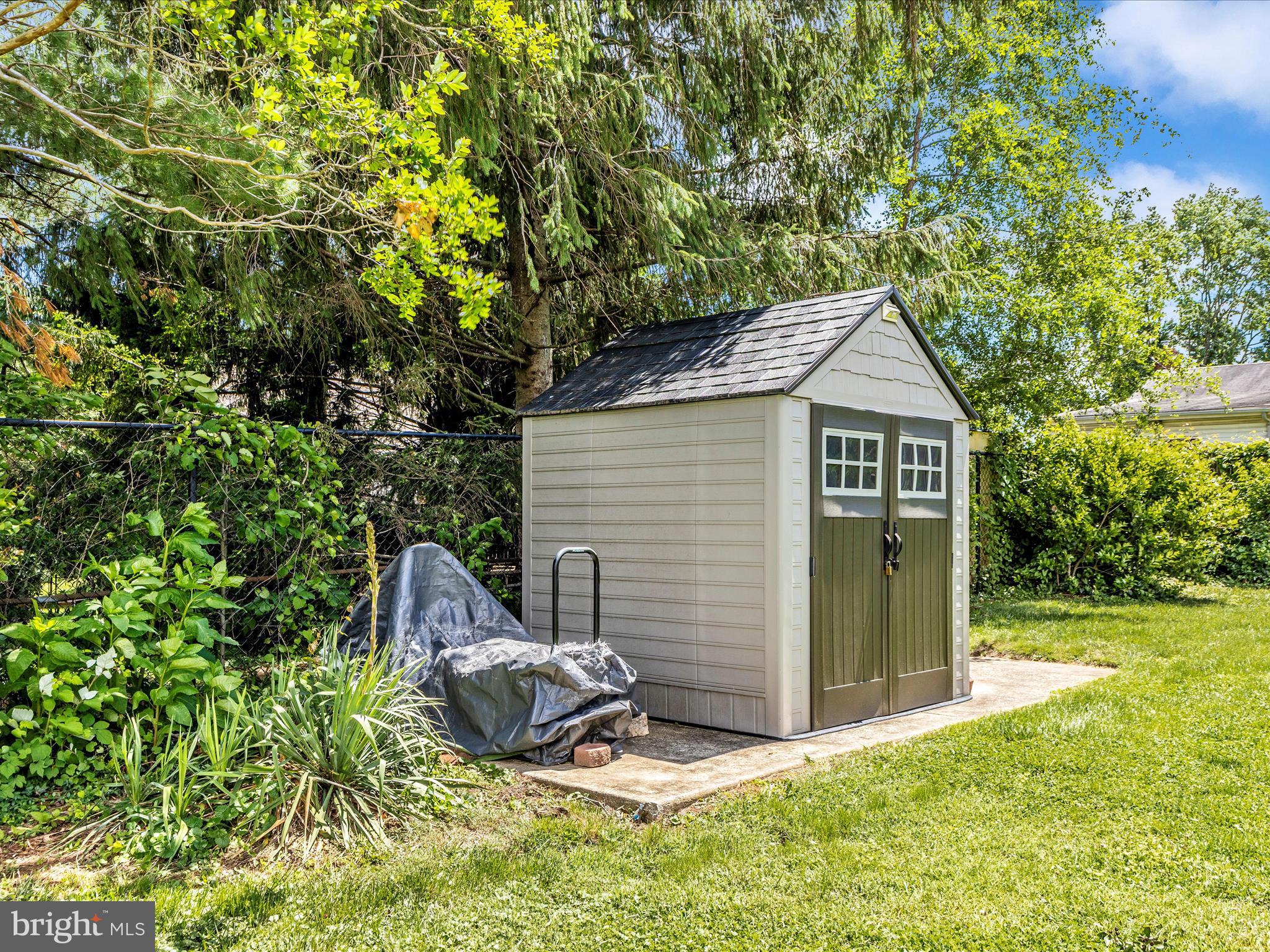 507 Kerwin Court Silver Spring, MD 20901 - Photo 44 of 51 a view of backyard with a barn and a large tree