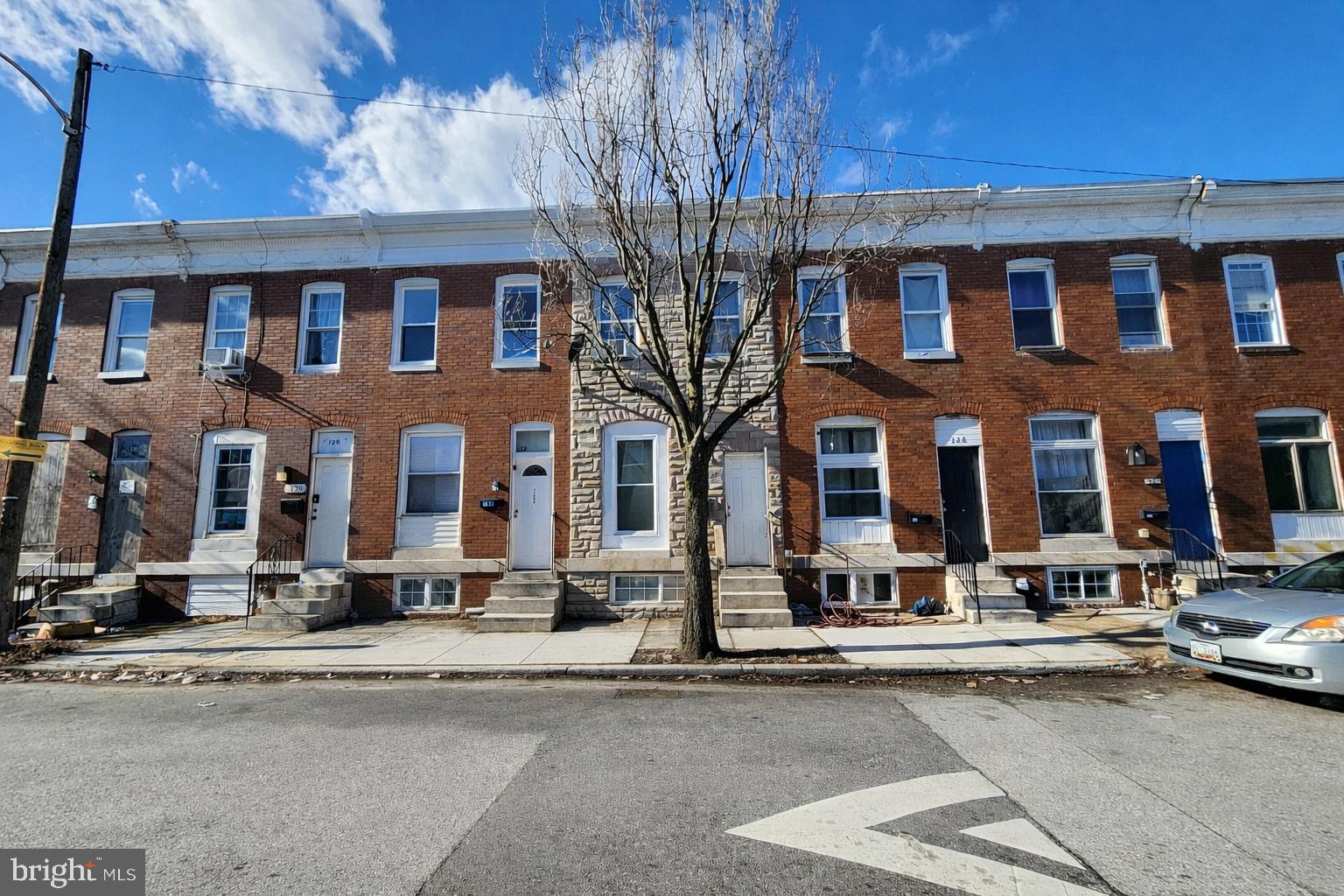 124 North Janney Street Baltimore, MD 21224 - Photo 2 of 6 a front view of a building with street view