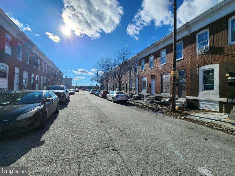 124 North Janney Street Baltimore, MD 21224 - Photo 5 of 6 a view of a street with cars