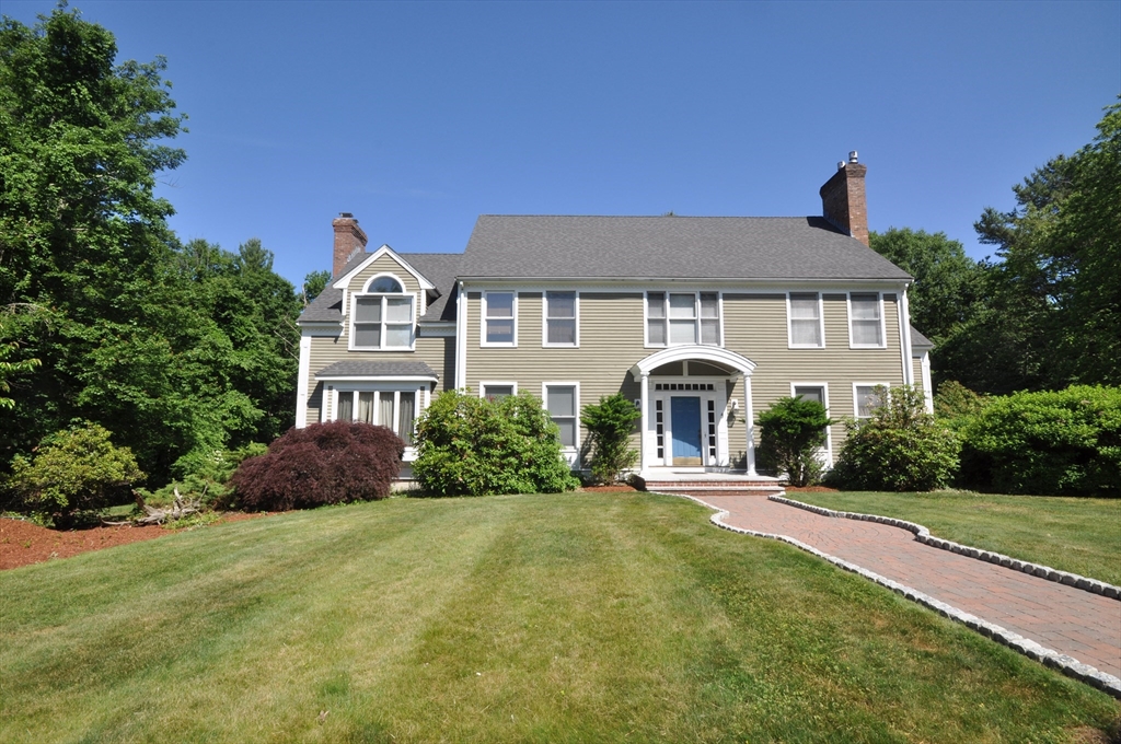 9 Breezy Point Road Acton, MA 01720 - Photo 2 of 37 a front view of a house with yard and green space