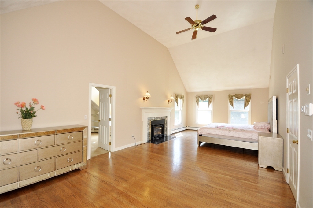 9 Breezy Point Road Acton, MA 01720 - Photo 22 of 37 a view of an empty room and window with wooden floor
