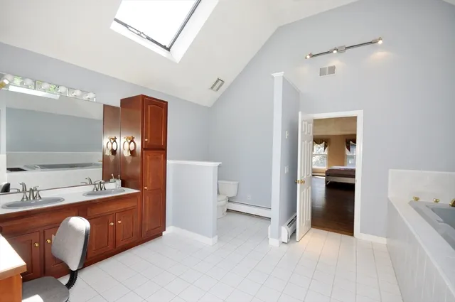a view of a bathroom sink and a mirror