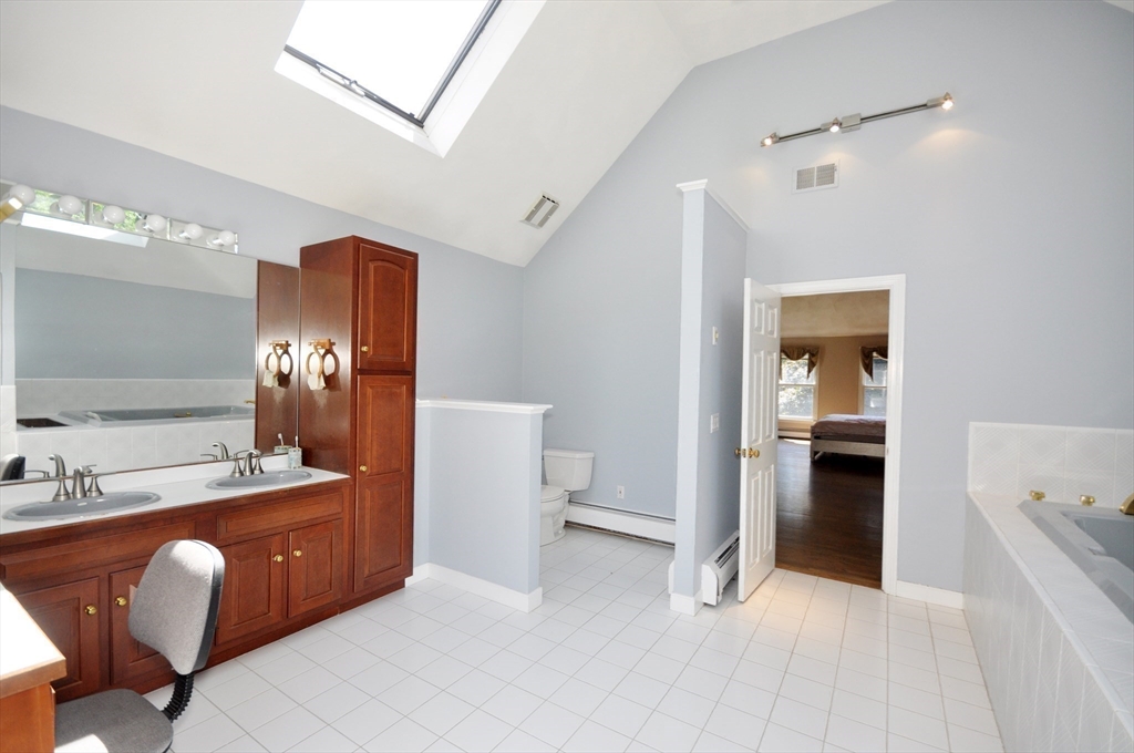 9 Breezy Point Road Acton, MA 01720 - Photo 25 of 37 a view of a bathroom sink and a mirror