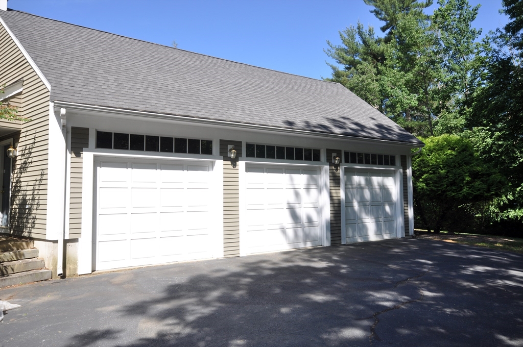 9 Breezy Point Road Acton, MA 01720 - Photo 3 of 37 a backyard of a house