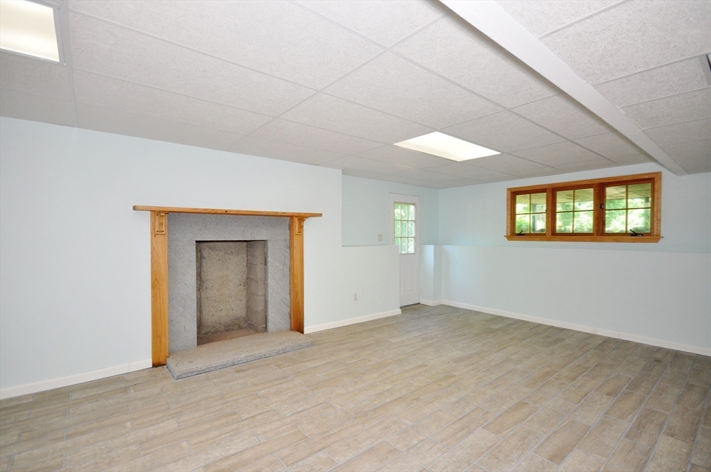 9 Breezy Point Road Acton, MA 01720 - Photo 31 of 37 an empty room with windows and closet