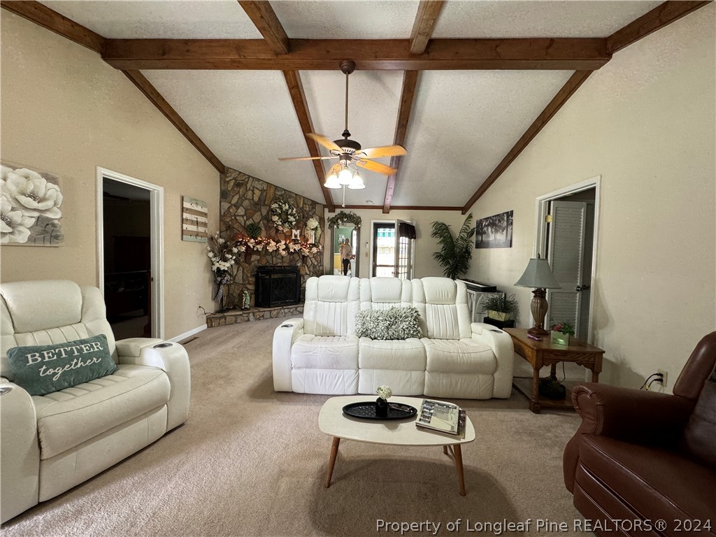 209 Old Farm Road Raeford, NC 28376 - Photo 11 of 45 a living room with furniture and a chandelier
