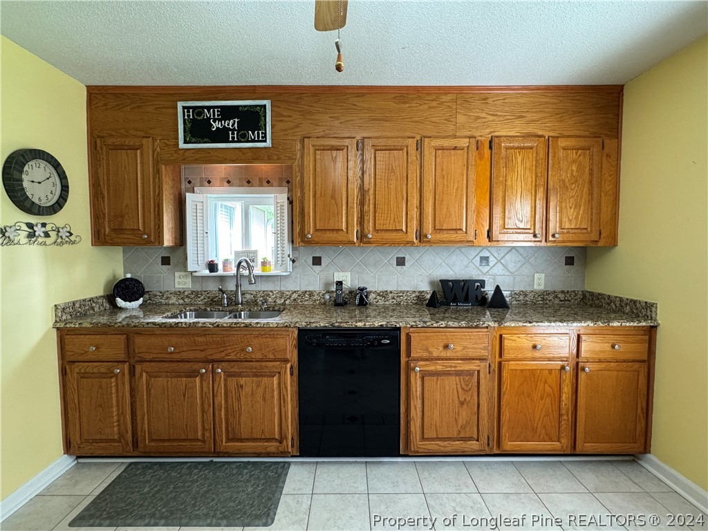 209 Old Farm Road Raeford, NC 28376 - Photo 20 of 45 a kitchen with a sink and cabinets