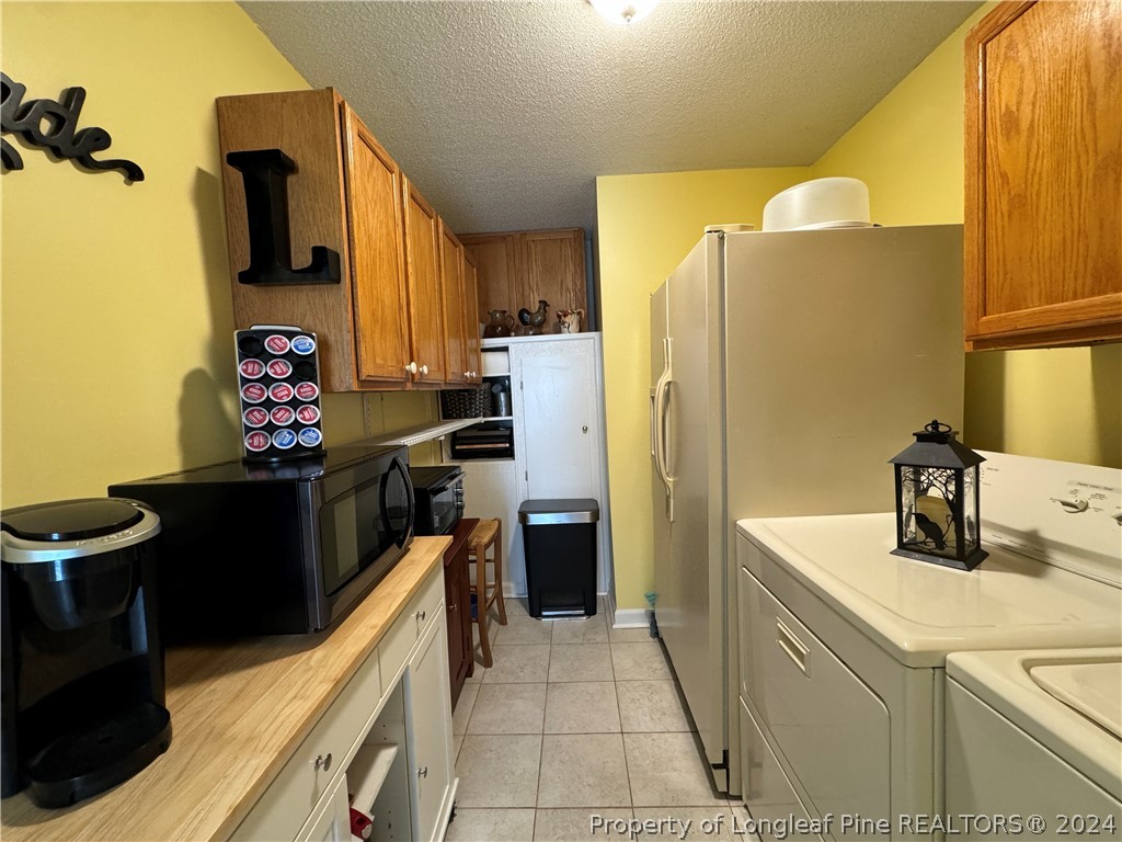 209 Old Farm Road Raeford, NC 28376 - Photo 22 of 45 a kitchen with a sink appliances and cabinets