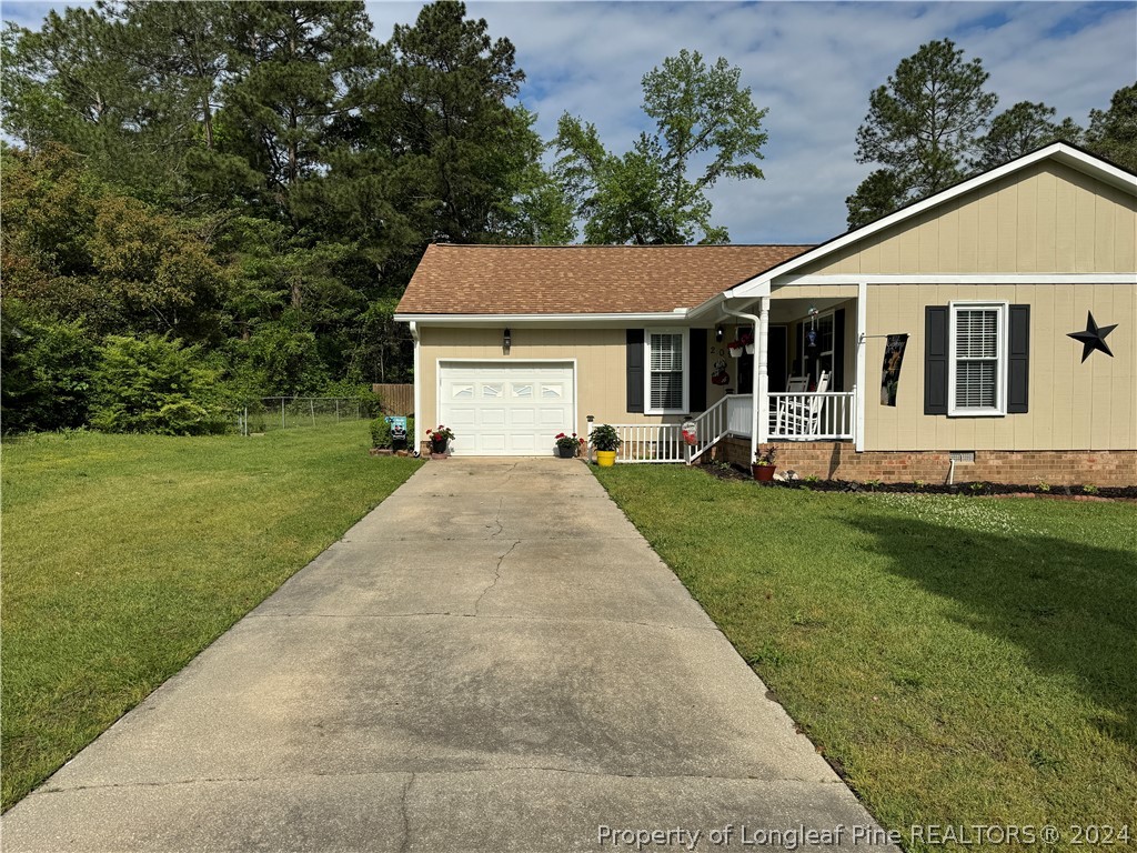 209 Old Farm Road Raeford, NC 28376 - Photo 3 of 45 a front view of house with yard and green space