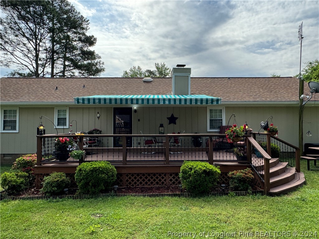 209 Old Farm Road Raeford, NC 28376 - Photo 38 of 45 a front view of a house with a garden