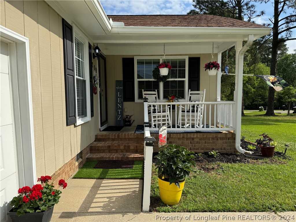 209 Old Farm Road Raeford, NC 28376 - Photo 4 of 45 a front view of a house with a yard