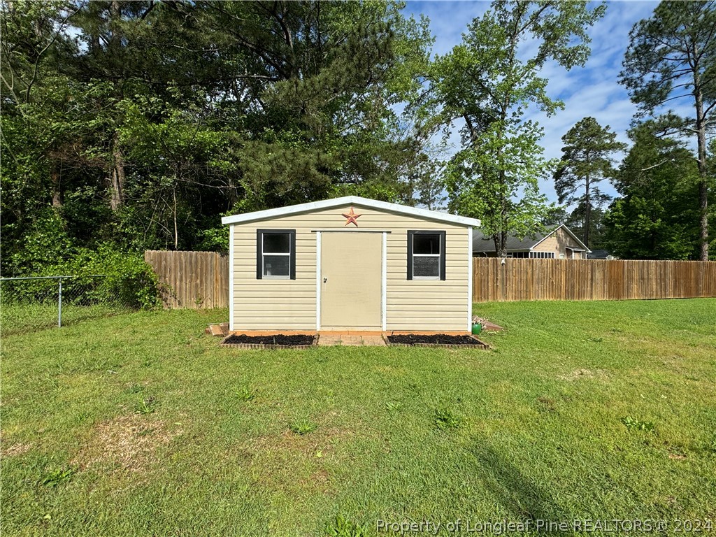 209 Old Farm Road Raeford, NC 28376 - Photo 42 of 45 a view of a house with backyard
