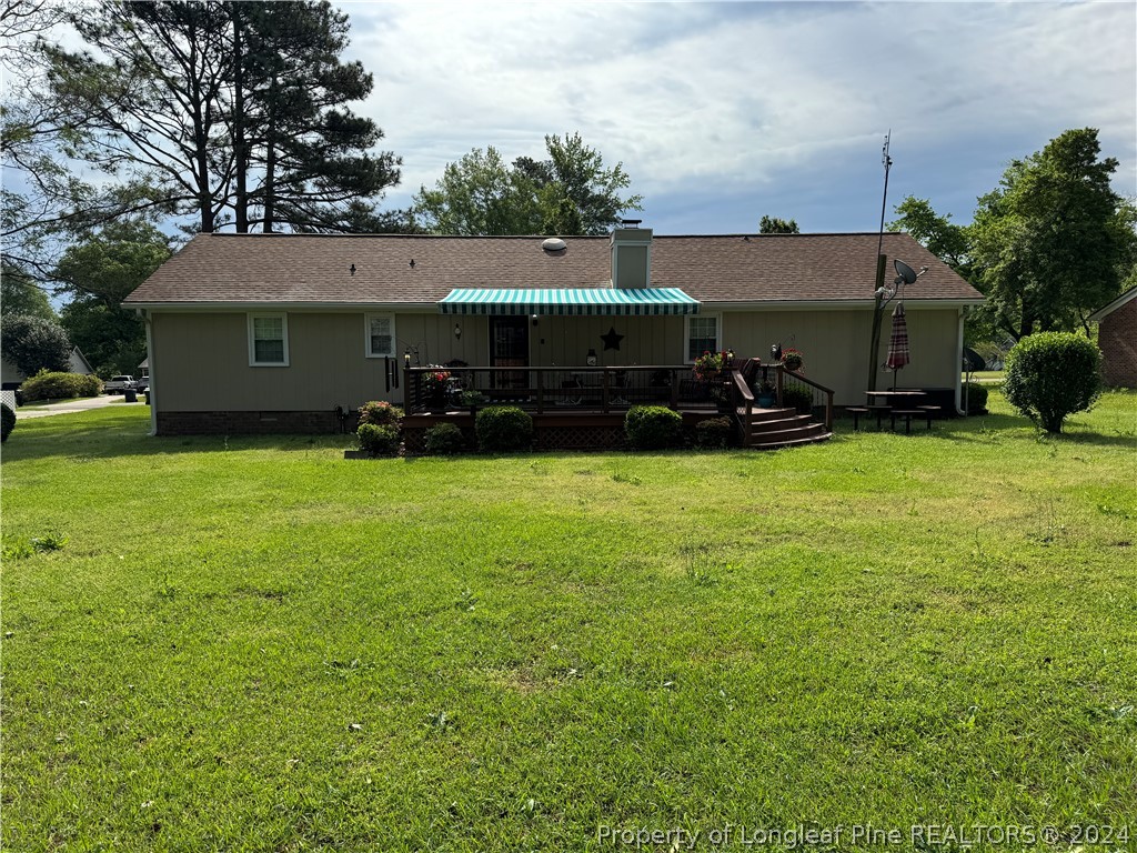 209 Old Farm Road Raeford, NC 28376 - Photo 45 of 45 a view of a house with yard and sitting area