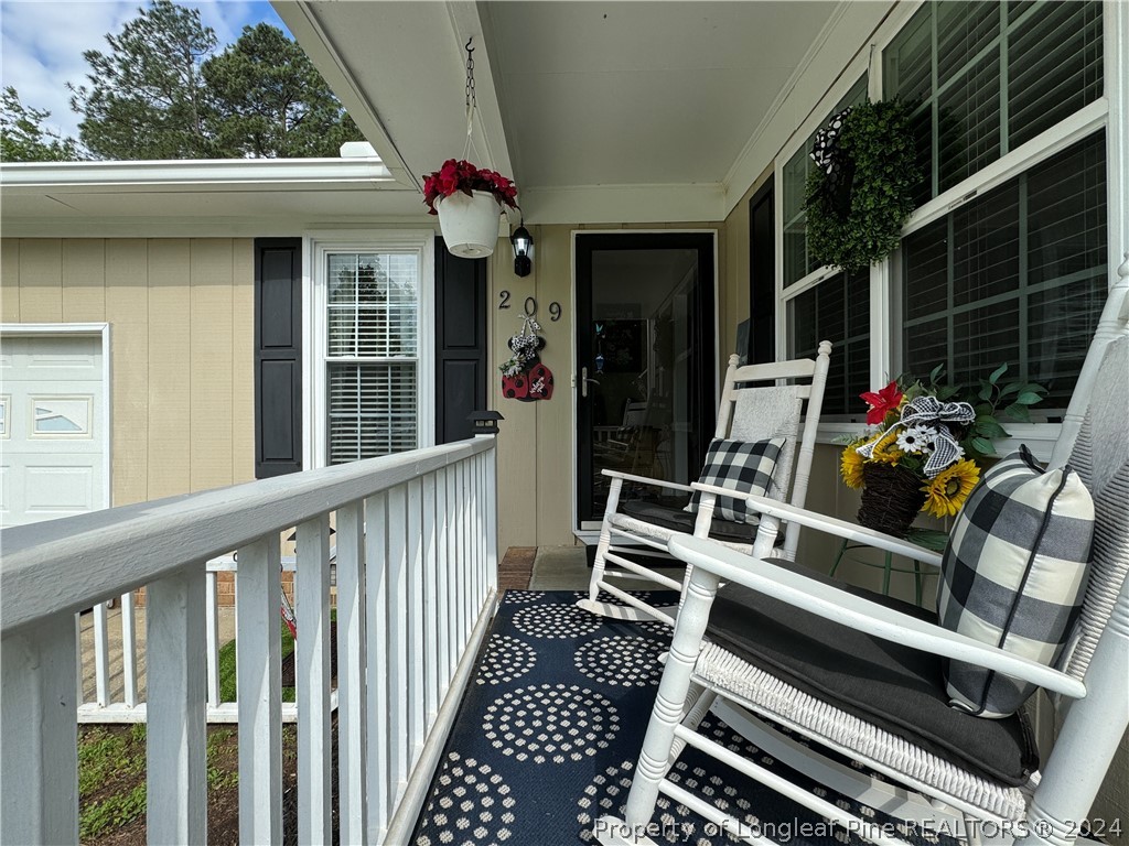 209 Old Farm Road Raeford, NC 28376 - Photo 5 of 45 a view of outdoor space and deck