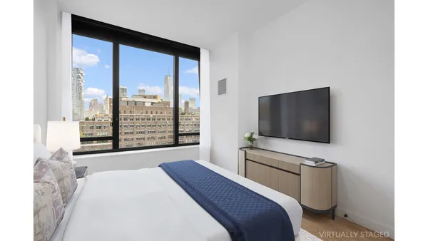 a kitchen with a dining table chairs and a refrigerator