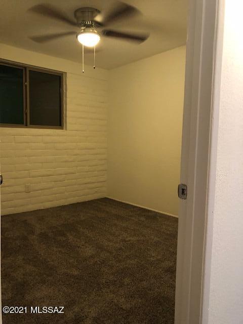 2961 South Lands End Road Tucson, AZ 85713 - Photo 23 of 30 a view of a livingroom with an empty space and a window