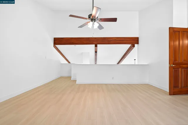 a view of room with a ceiling fan