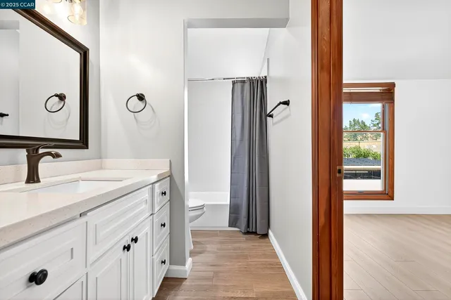 a bathroom with a sink a mirror and a shower