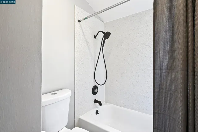 a bathroom with a bath tub and a shower