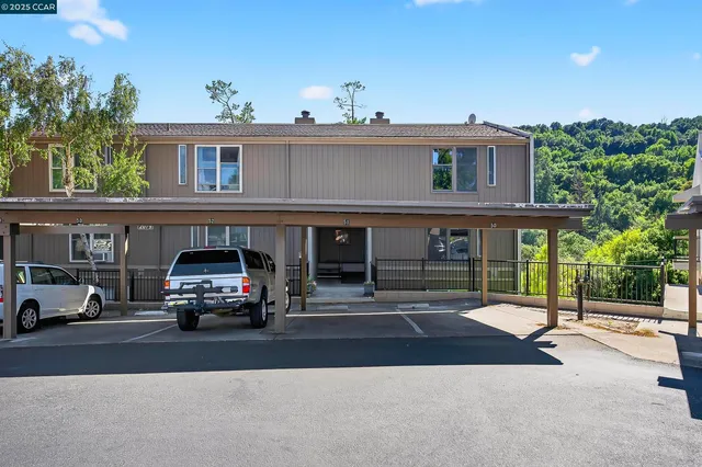 a view of a swimming pool with a yard and lake view