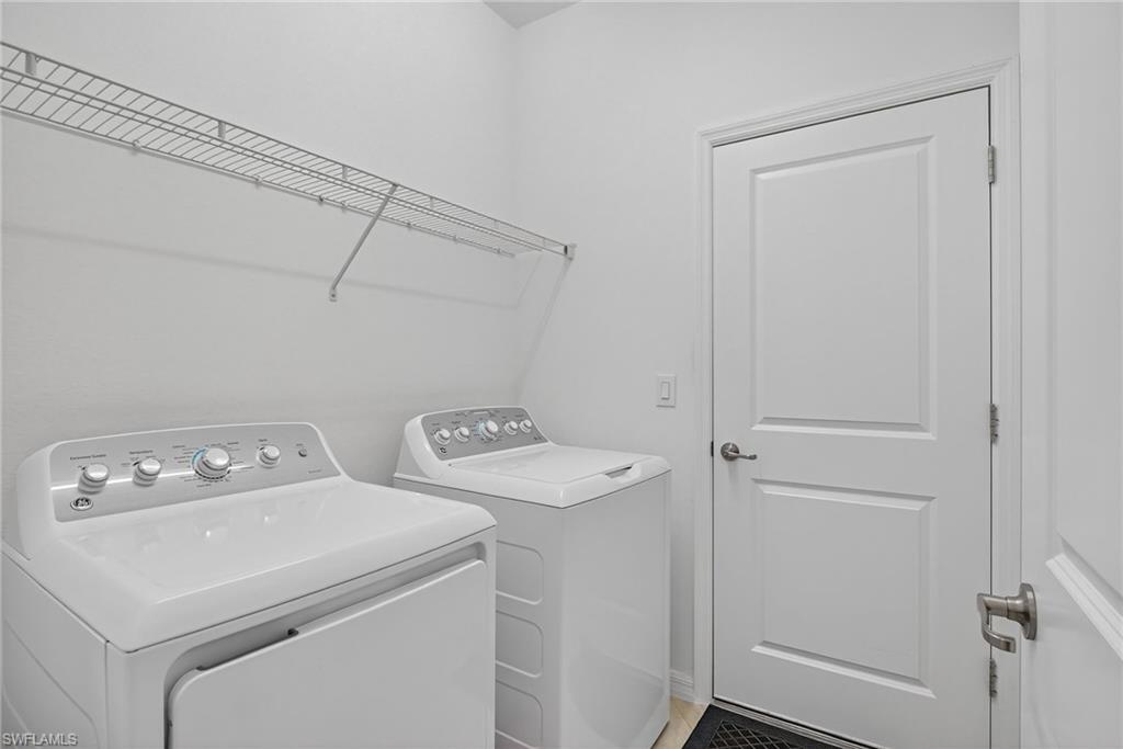 2126 Hamlin Street Naples, FL 34120 - Photo 24 of 38 a utility room with dryer and washer