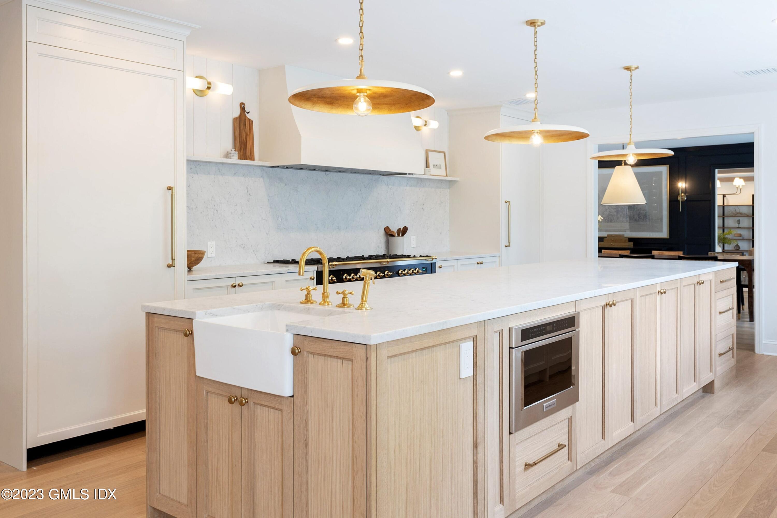 48 Old Mill Road Greenwich, CT 06831 - Photo 13 of 47 a kitchen with a sink a stove and a microwave