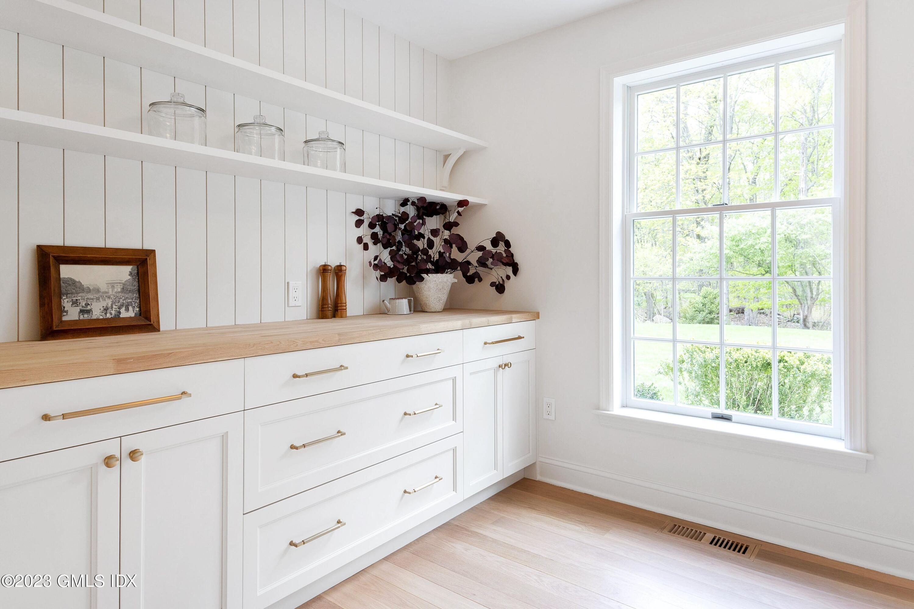 48 Old Mill Road Greenwich, CT 06831 - Photo 17 of 47 a bathroom with a sink and a mirror