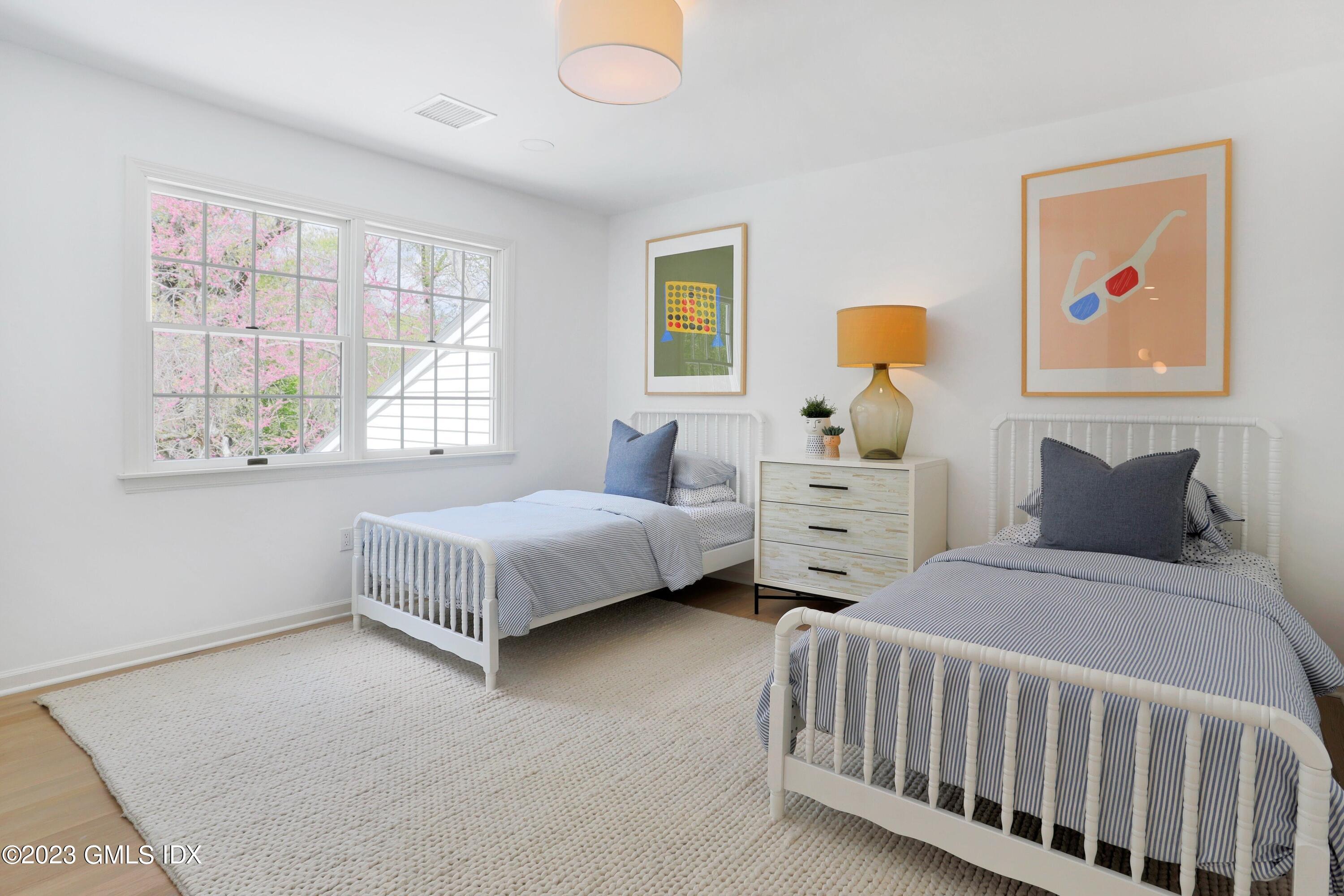 48 Old Mill Road Greenwich, CT 06831 - Photo 29 of 47 a bedroom with two beds and a window