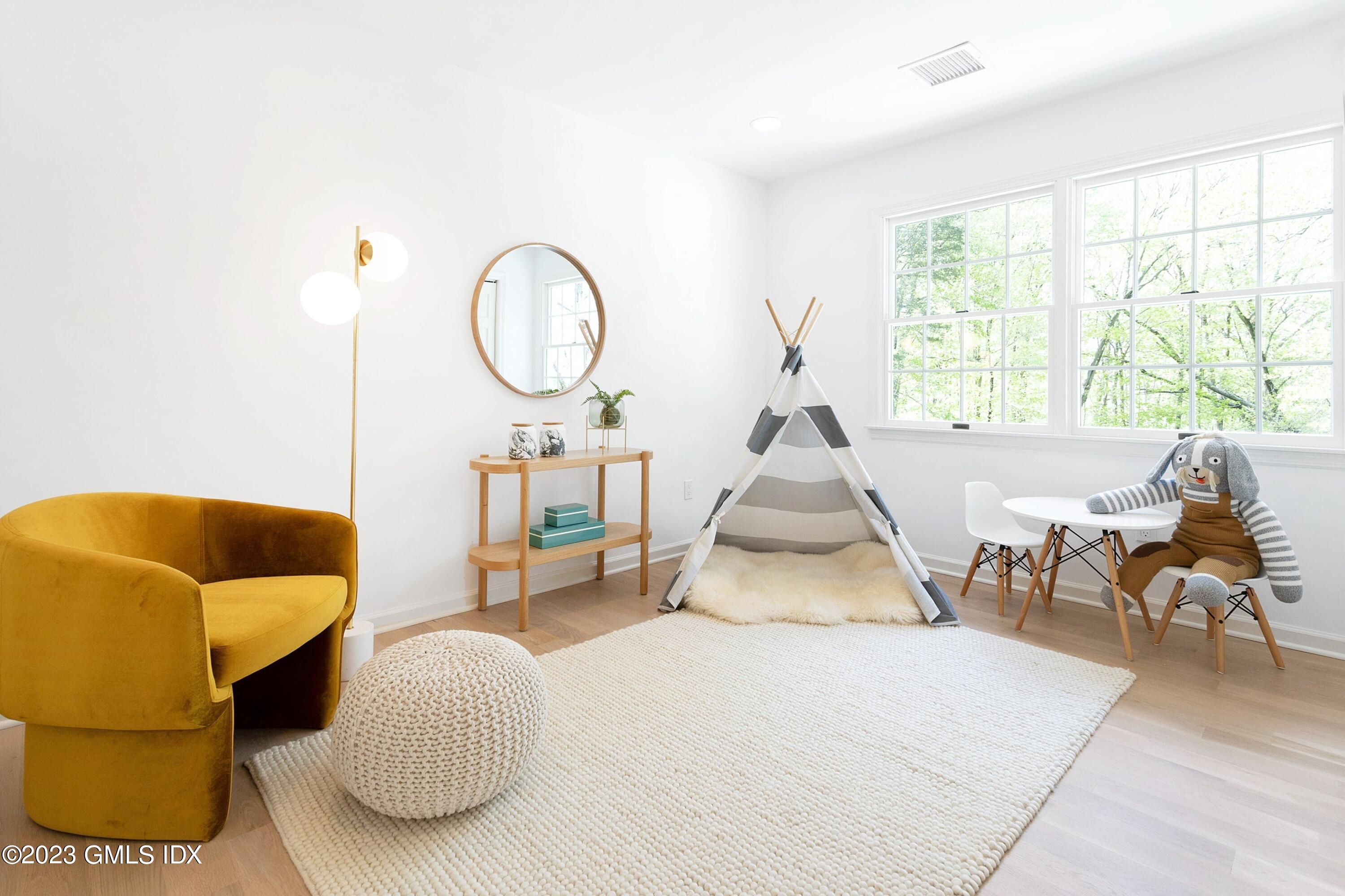 48 Old Mill Road Greenwich, CT 06831 - Photo 30 of 47 a living room with furniture a table and white walls
