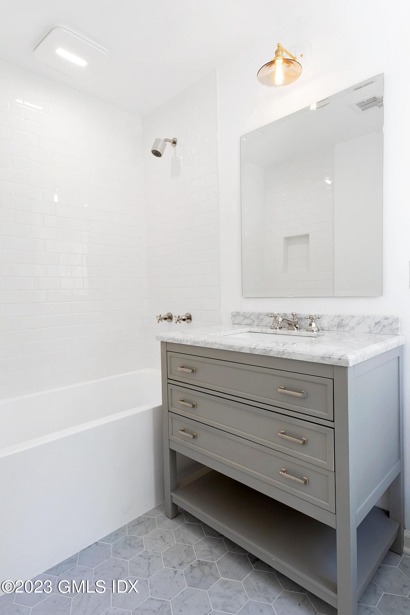 48 Old Mill Road Greenwich, CT 06831 - Photo 31 of 47 a bathroom with a bathtub and a sink