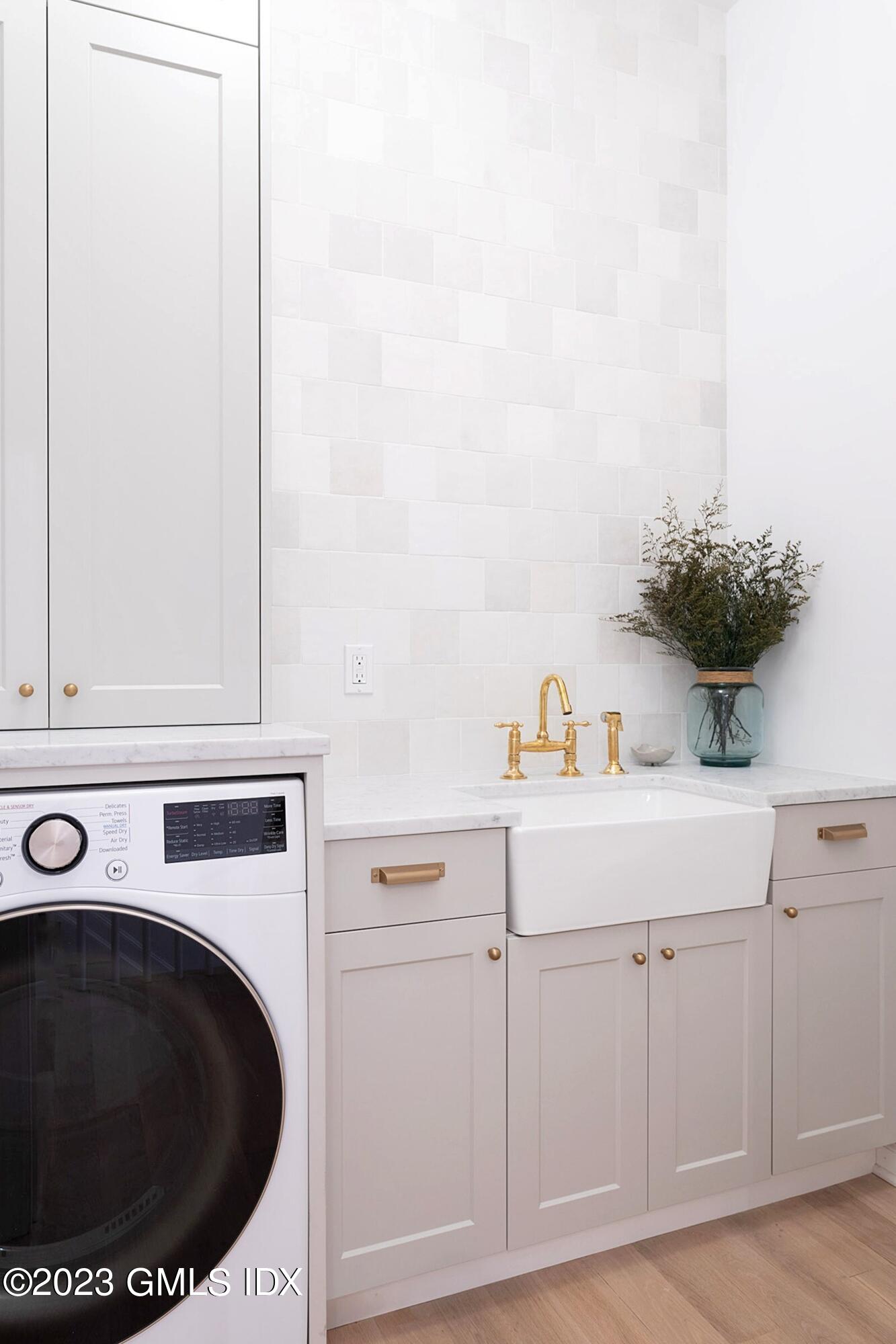 48 Old Mill Road Greenwich, CT 06831 - Photo 37 of 47 a utility room with sink dryer and washer