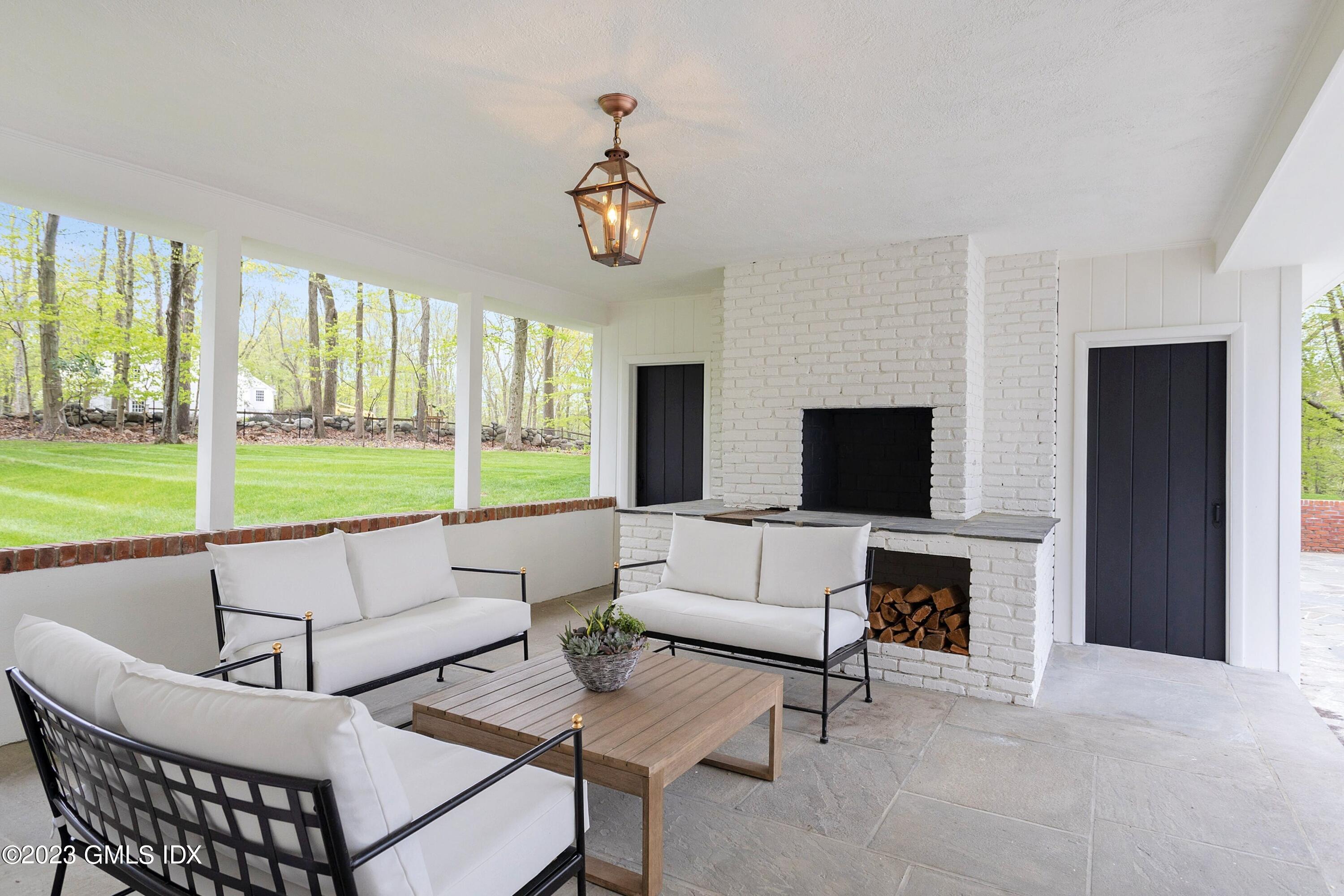48 Old Mill Road Greenwich, CT 06831 - Photo 39 of 47 a living room with furniture and a flat screen tv