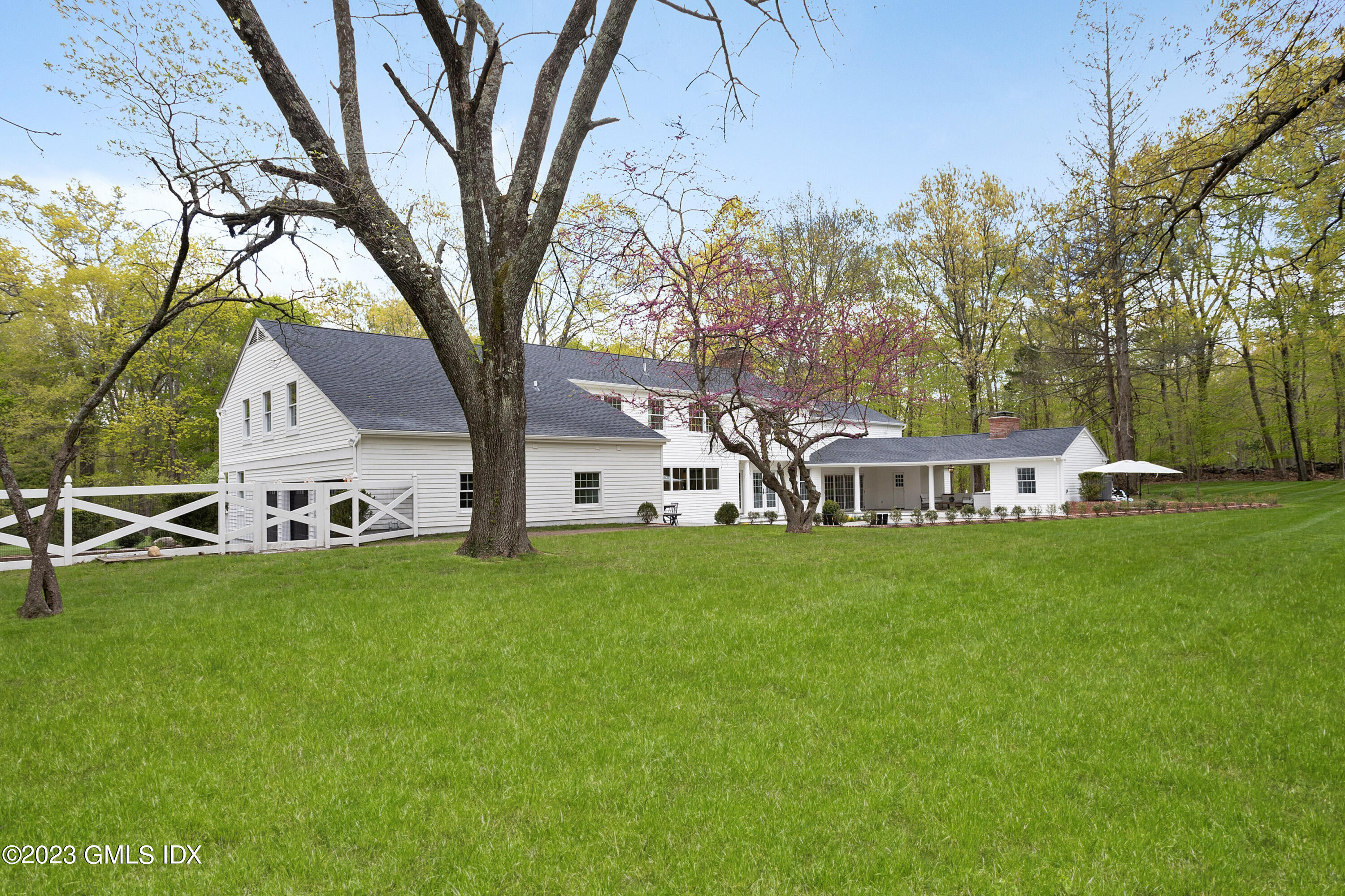 48 Old Mill Road Greenwich, CT 06831 - Photo 43 of 47 a front view of house with yard and green space