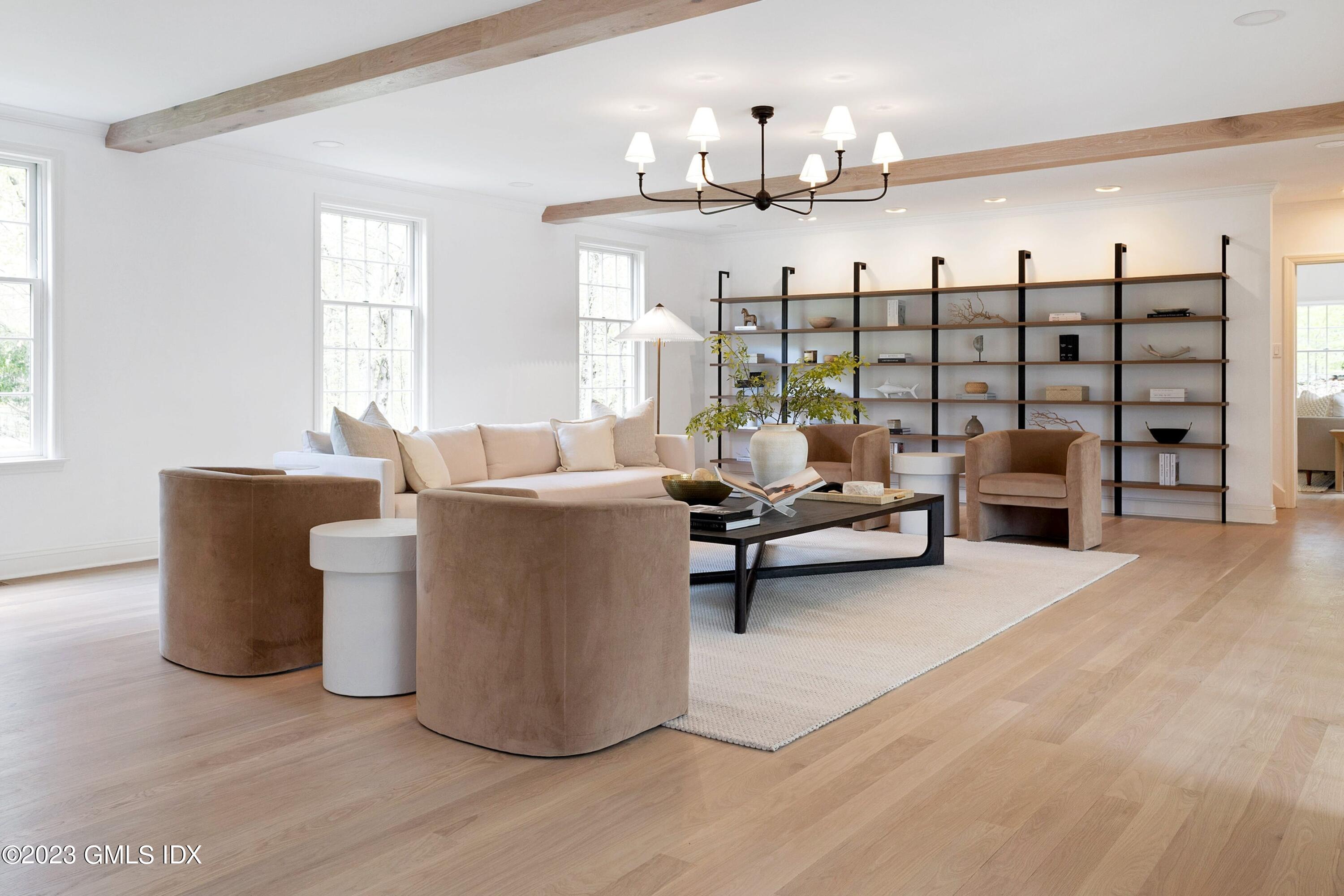 48 Old Mill Road Greenwich, CT 06831 - Photo 8 of 47 a living room with furniture a chandelier and a flat screen tv