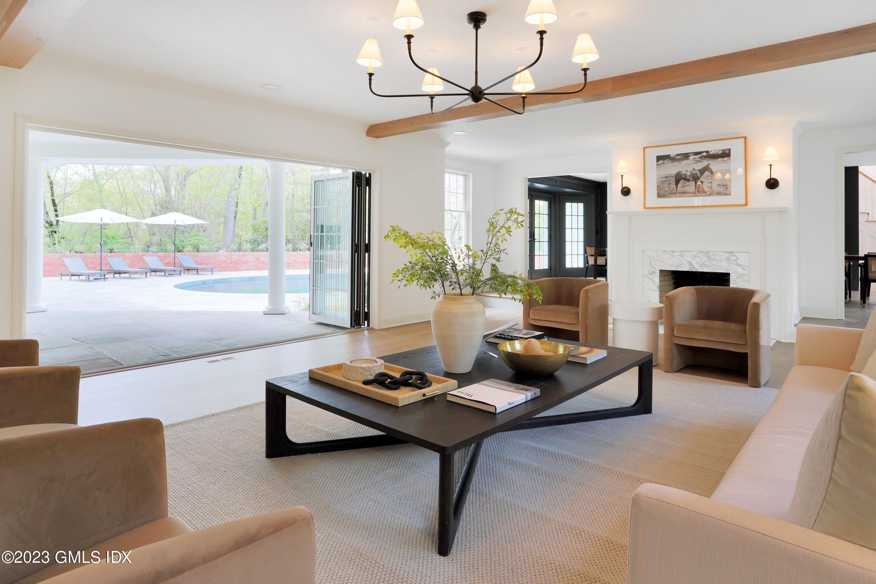 48 Old Mill Road Greenwich, CT 06831 - Photo 9 of 47 a living room with furniture and a large window
