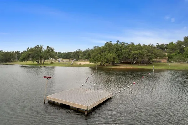 a view of a lake with houses in background