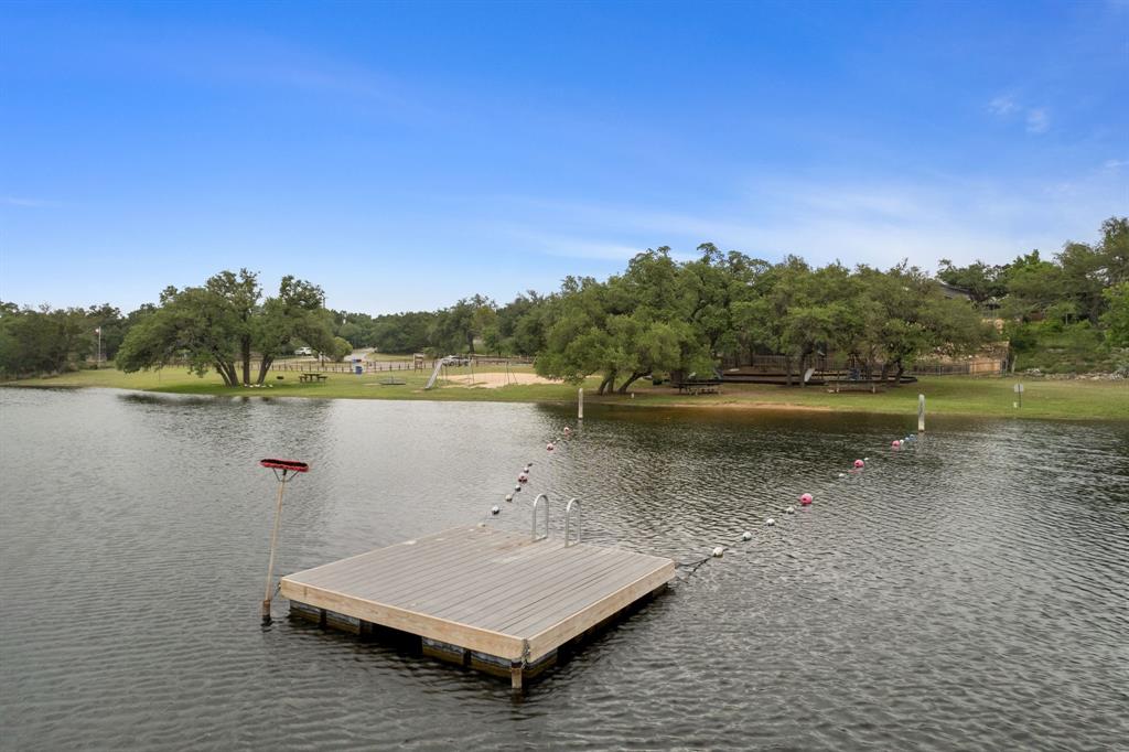 a view of a lake with houses in background