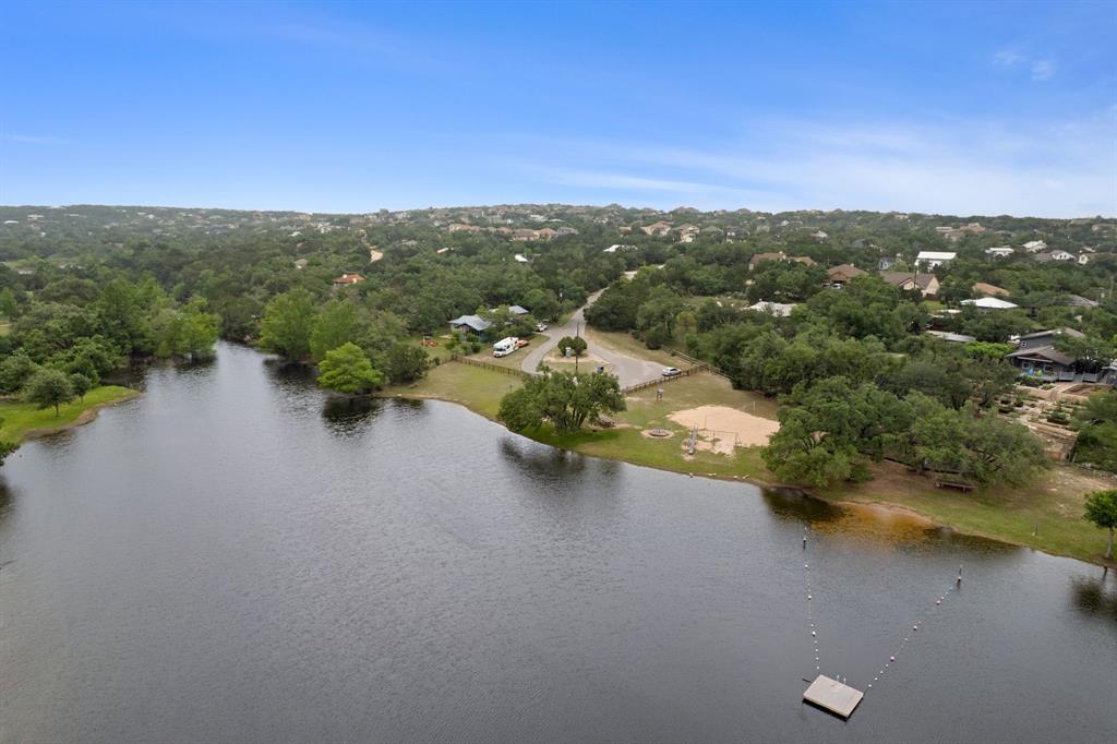 10201 Sandy Beach Road Dripping Springs, TX 78620 - Photo 2 of 13 an aerial view of residential houses with outdoor space and trees