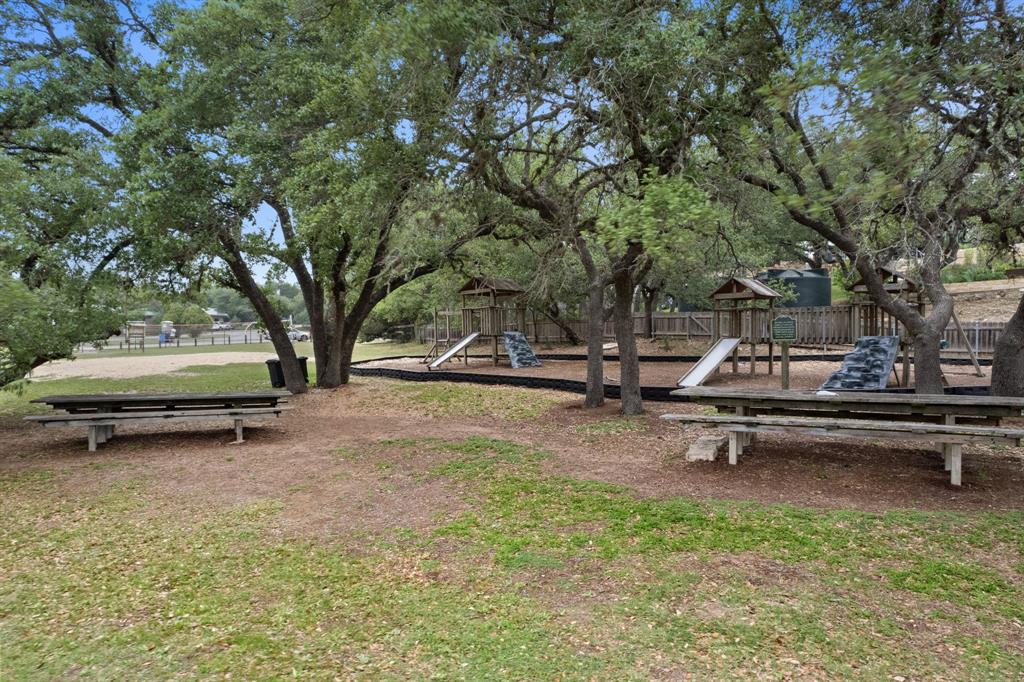 10201 Sandy Beach Road Dripping Springs, TX 78620 - Photo 4 of 13 a park view with a bench and trees