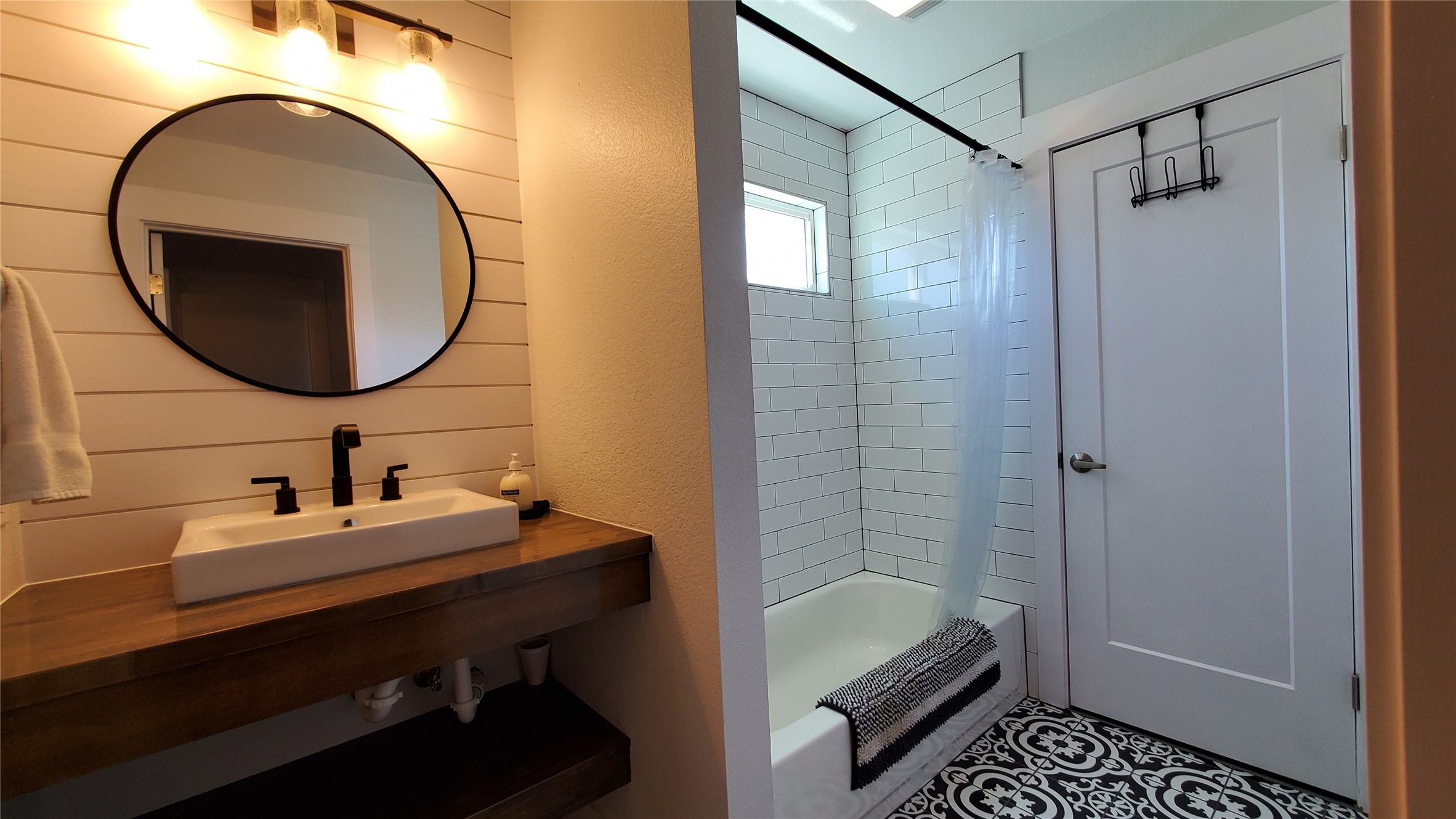 10201 Sandy Beach Road Dripping Springs, TX 78620 - Photo 5 of 13 a bathroom with a sink and a mirror