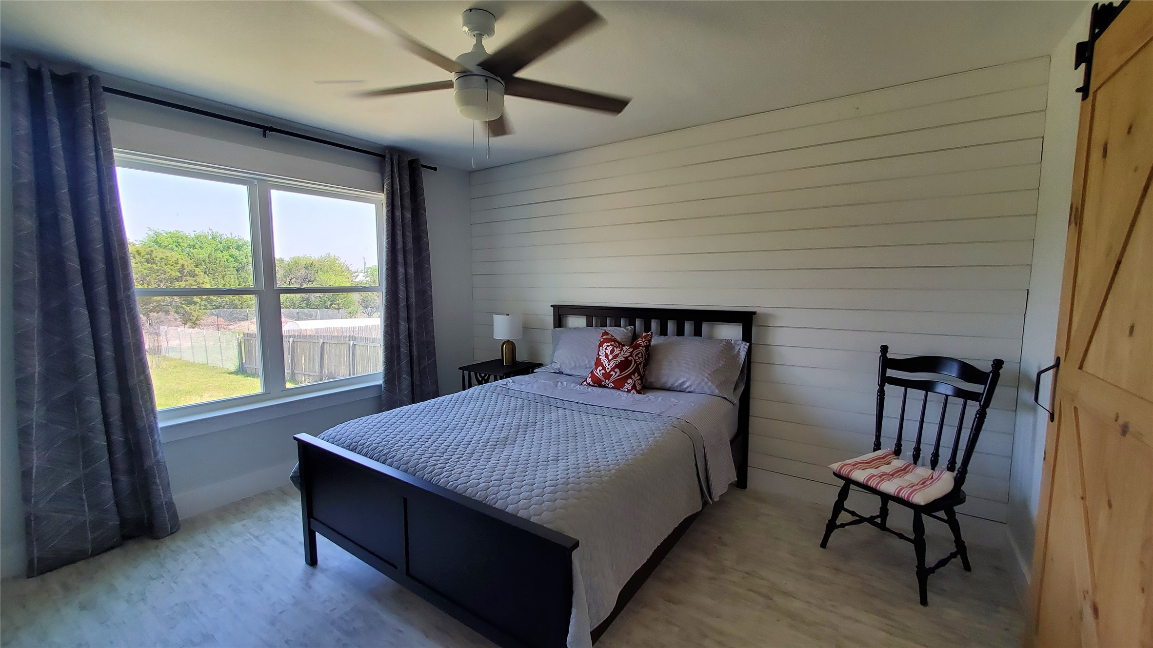 10201 Sandy Beach Road Dripping Springs, TX 78620 - Photo 7 of 13 a bedroom with a bed and a window