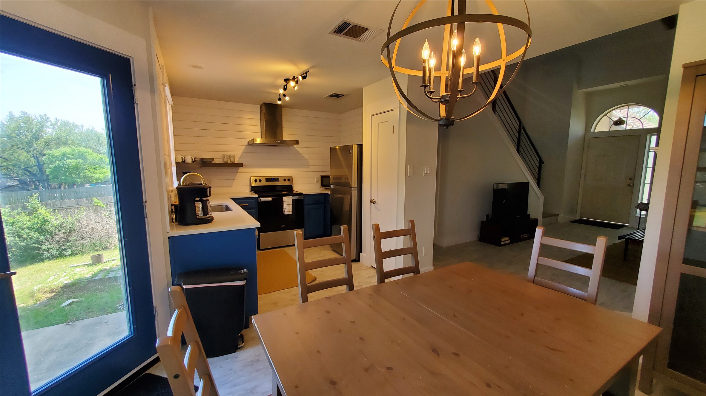 10201 Sandy Beach Road Dripping Springs, TX 78620 - Photo 8 of 13 a view of a livingroom with furniture and a floor to ceiling window