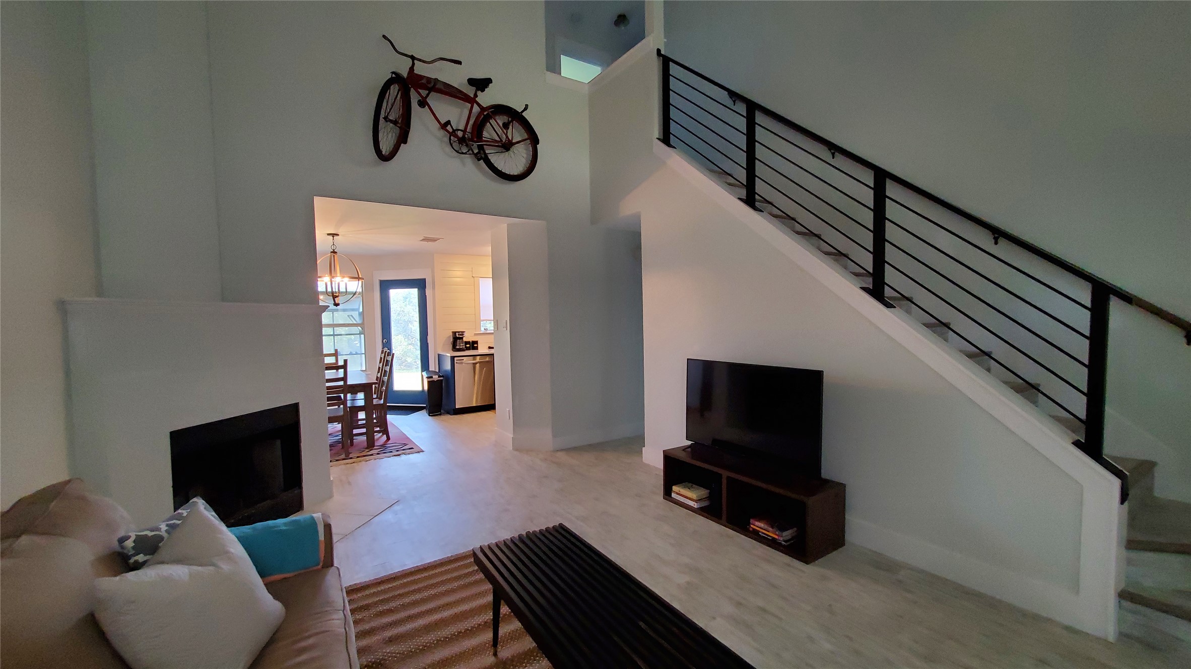 10201 Sandy Beach Road Dripping Springs, TX 78620 - Photo 9 of 13 a living room with furniture and a flat screen tv