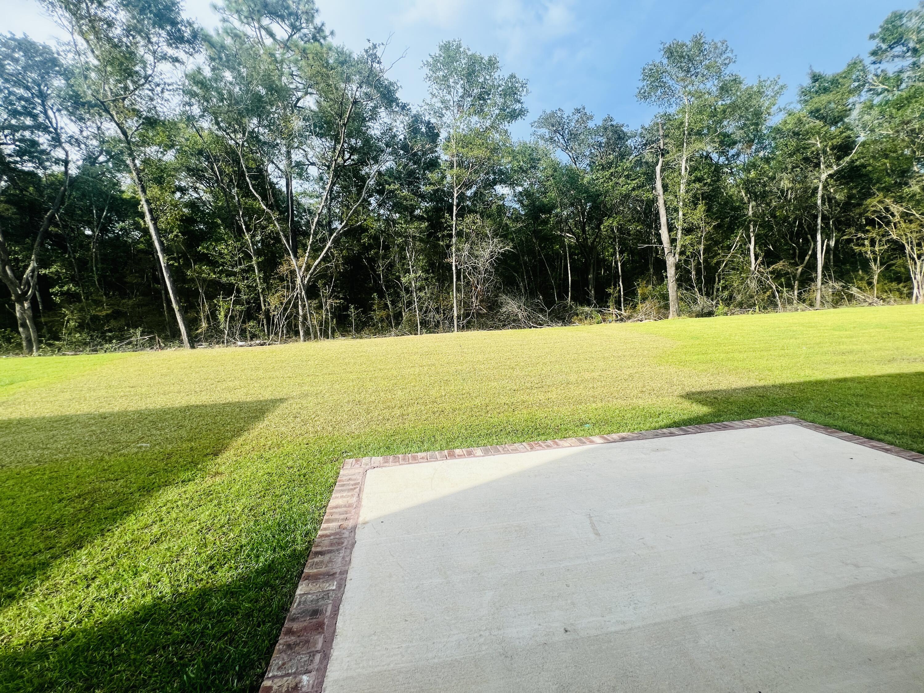 5299 Hidden Pines Circle Milton, FL 32583 - Photo 13 of 33 a view of a golf course with a trees
