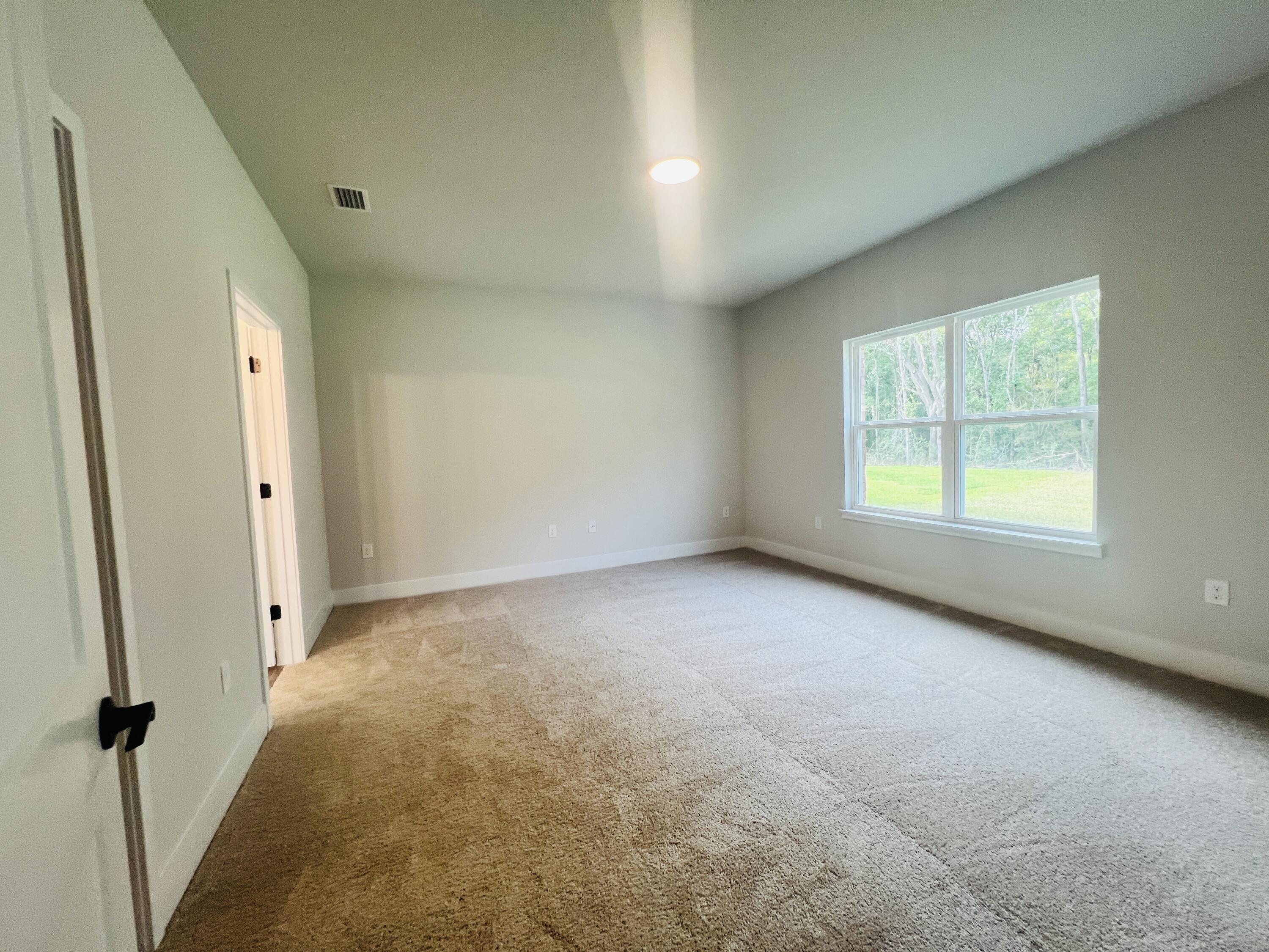 5299 Hidden Pines Circle Milton, FL 32583 - Photo 15 of 33 an empty room with windows