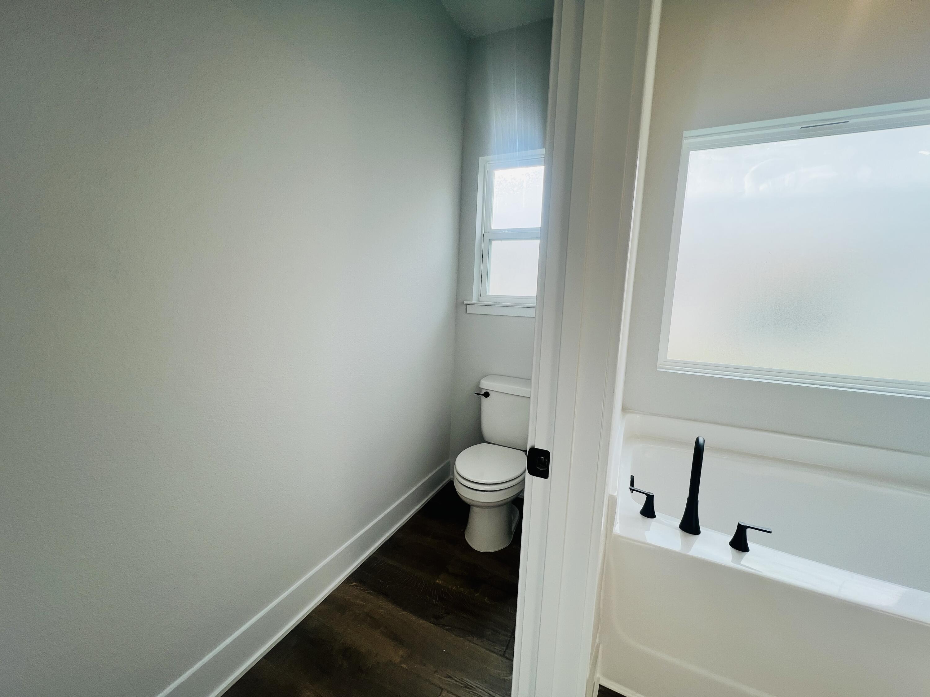 5299 Hidden Pines Circle Milton, FL 32583 - Photo 20 of 33 a bathroom with a toilet and a sink