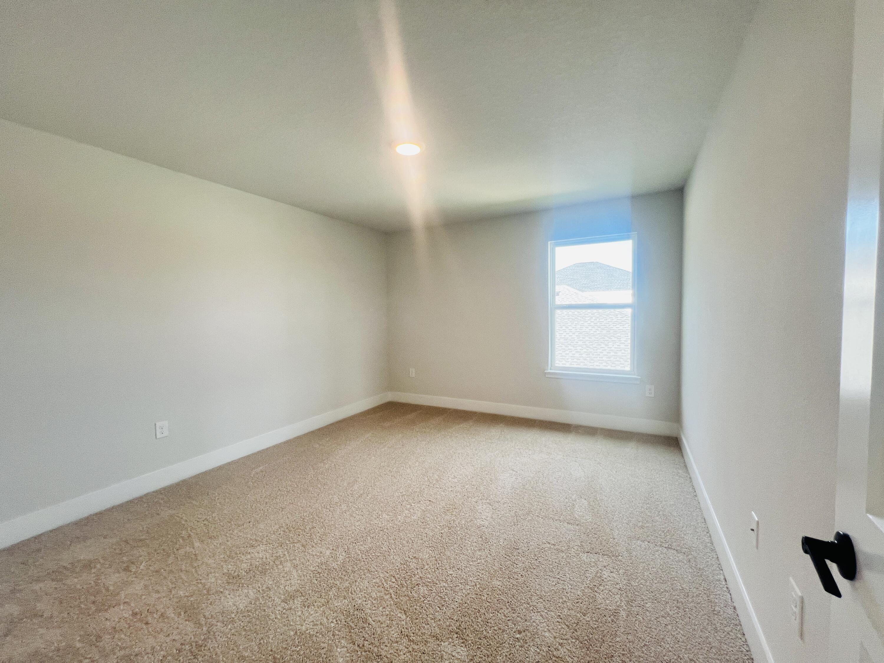 5299 Hidden Pines Circle Milton, FL 32583 - Photo 25 of 33 an empty room with a window