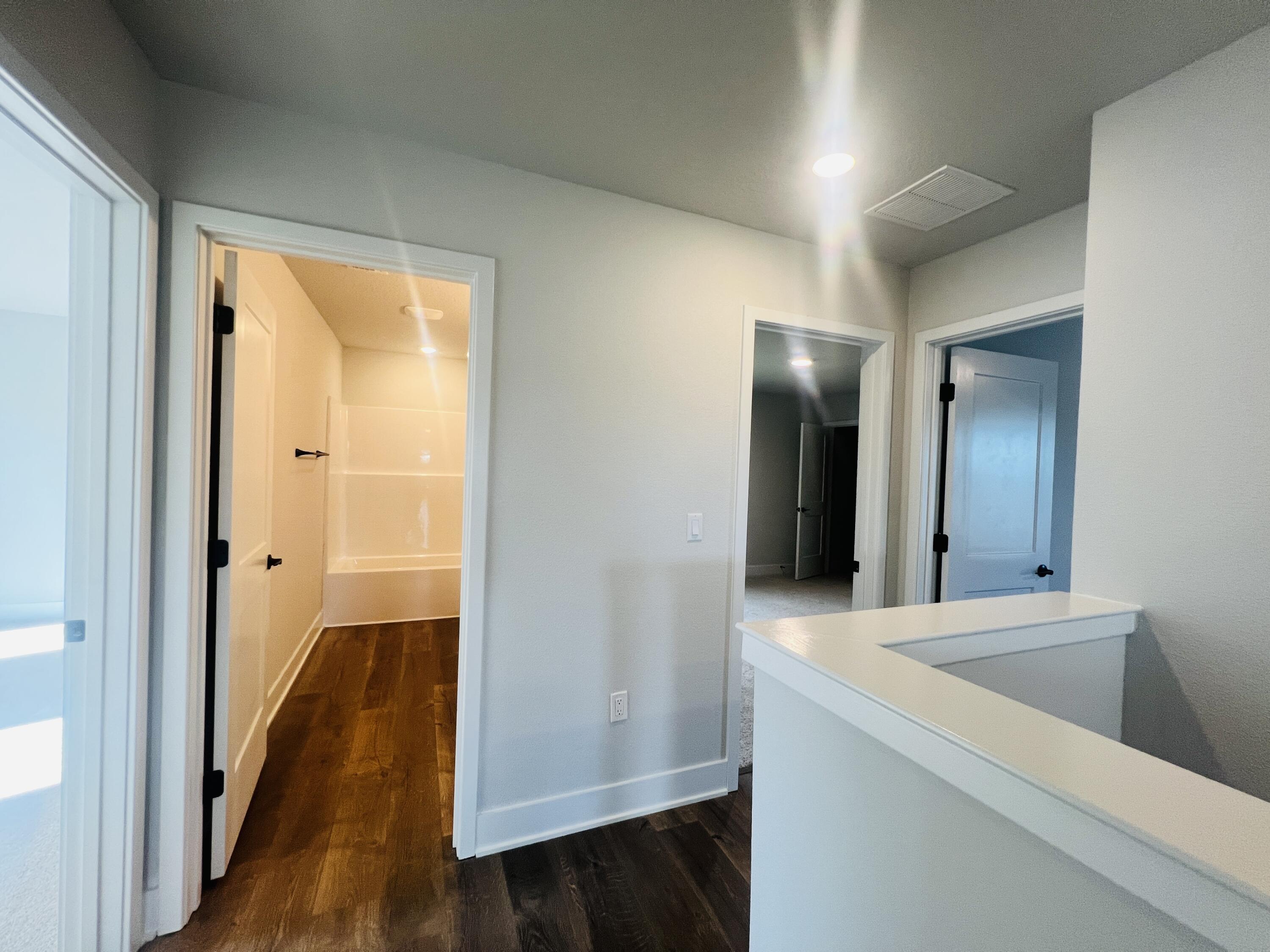5299 Hidden Pines Circle Milton, FL 32583 - Photo 30 of 33 a view of a hallway view with wooden floor and staircase